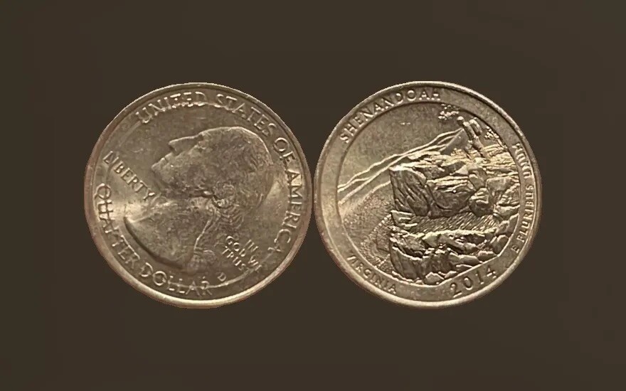 2014 quarter off-center strike error showing blank planchet area with design displaced from center